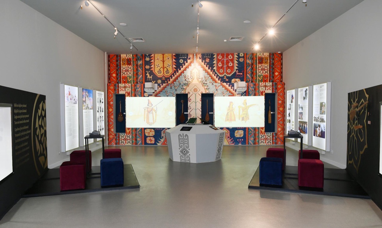 Carpet-backdrop gallery with interactive projections at the Ashug Art Museum