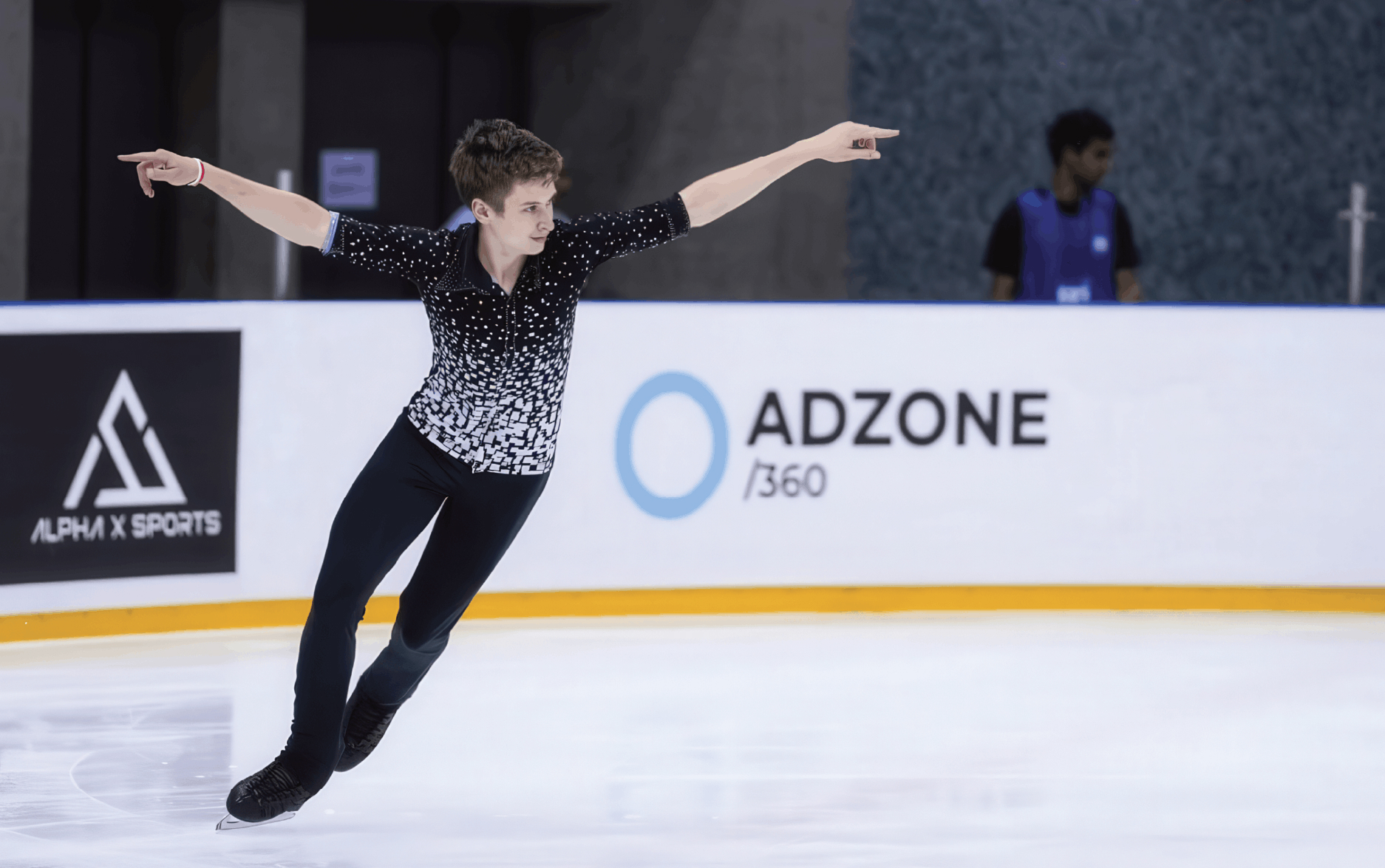 Wide view of the ice arena with audience during competition