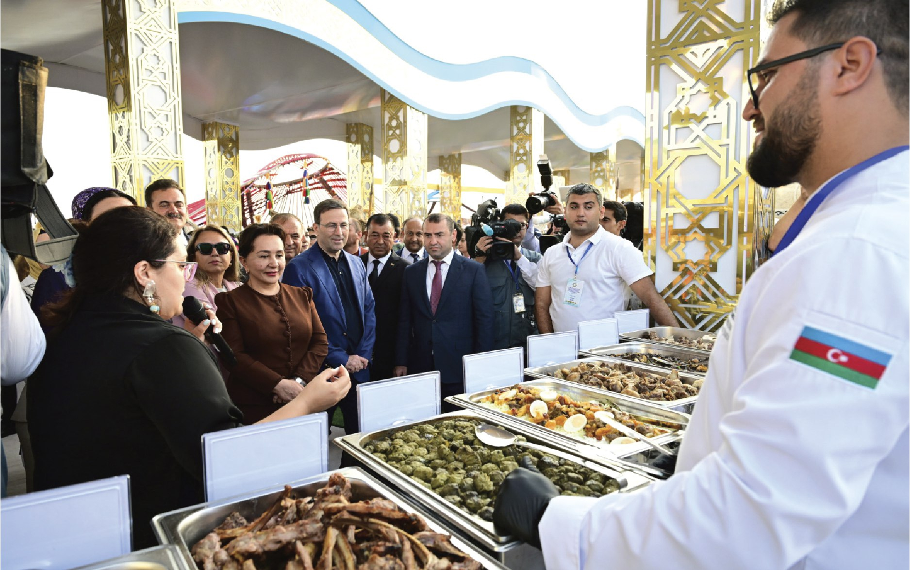 Cultural showcase and branded backdrop at the national celebration